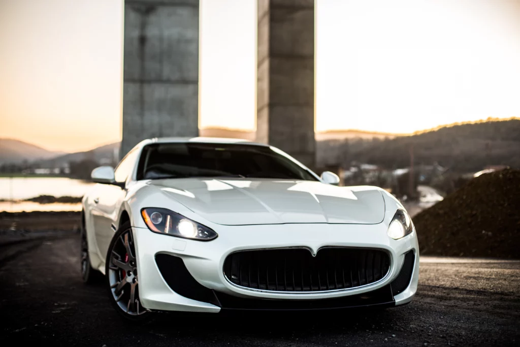 white coupe sport car standing road front view